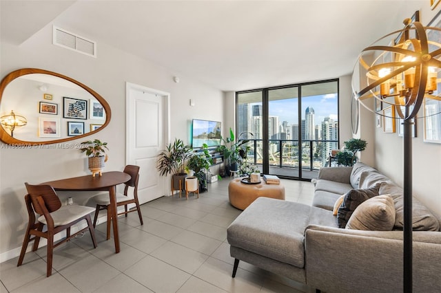 1600 NE 1st Ave Unit 2907, Miami, FL 33132 - living room with floor to ceiling windows, a chandelier, plenty of natural light, light tile patterned flooring, and baseboards