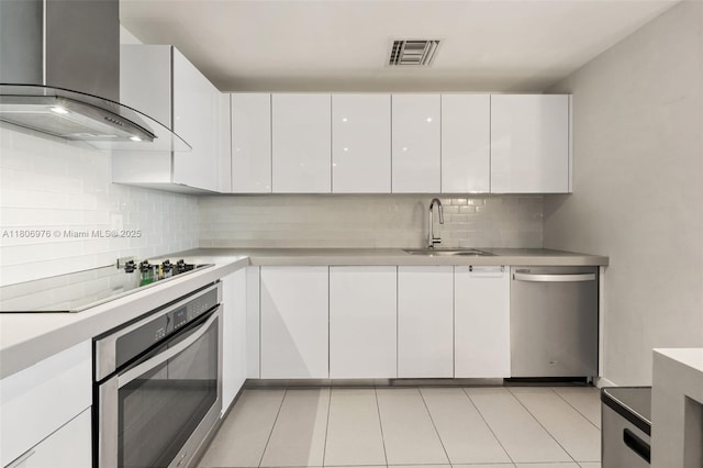 1600 NE 1st Ave Unit 2907, Miami, FL 33132 - kitchen with appliances with stainless steel finishes, wall chimney range hood, a sink, and white cabinets