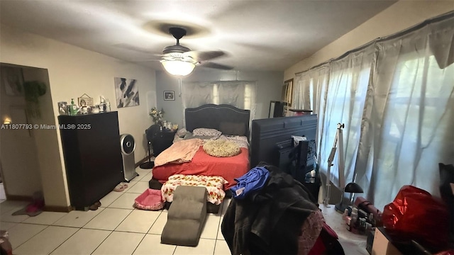1230 NW 113th Ter, Miami, FL 33167 - bedroom with light tile patterned floors and a ceiling fan
