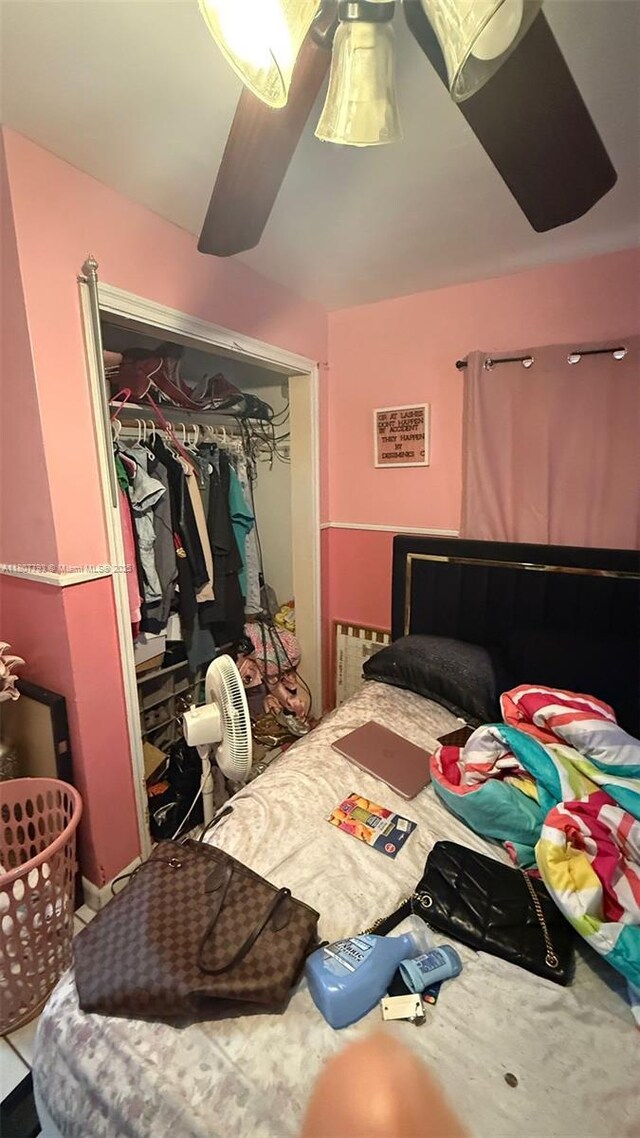 1230 NW 113th Ter, Miami, FL 33167 - bedroom featuring a closet, vaulted ceiling, and a ceiling fan