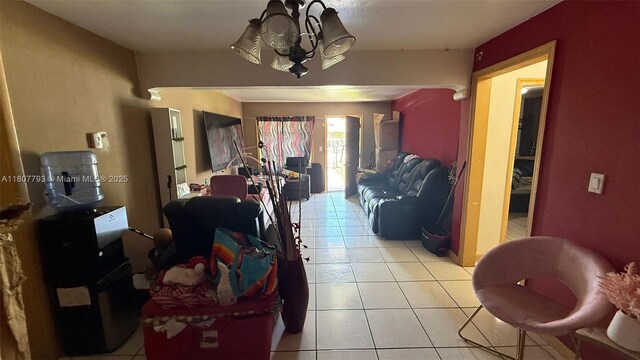 1230 NW 113th Ter, Miami, FL 33167 - living area featuring light tile patterned floors and a chandelier