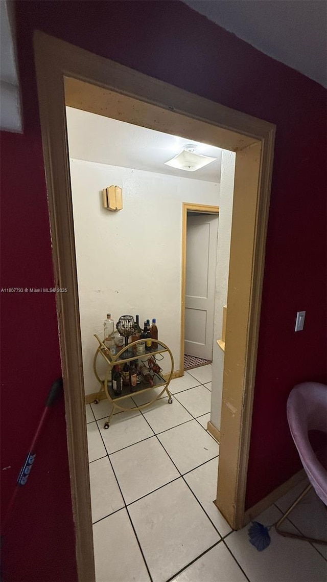 1230 NW 113th Ter, Miami, FL 33167 - hallway with light tile patterned floors and baseboards