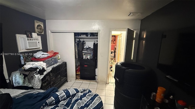 1230 NW 113th Ter, Miami, FL 33167 - bedroom with tile patterned floors, a closet, and cooling unit