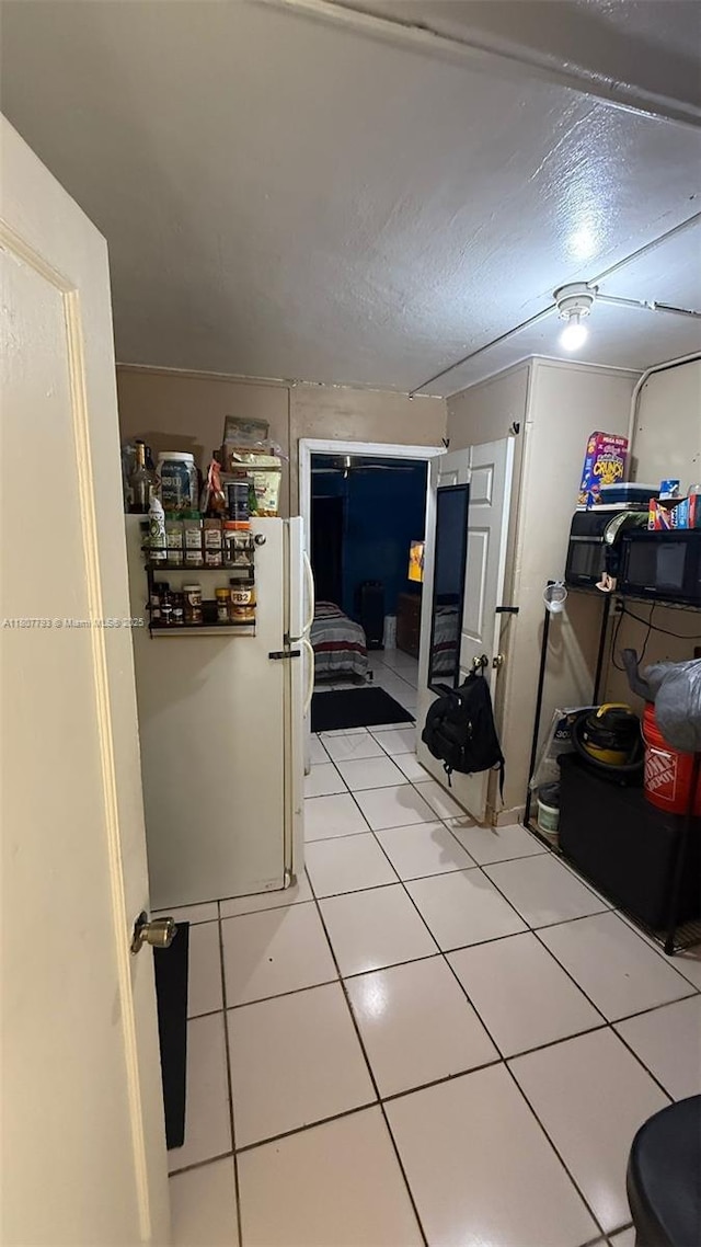 1230 NW 113th Ter, Miami, FL 33167 - corridor featuring light tile patterned floors