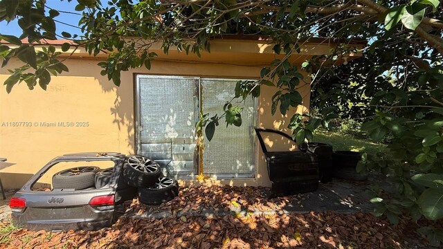 1230 NW 113th Ter, Miami, FL 33167 - view of property exterior featuring stucco siding