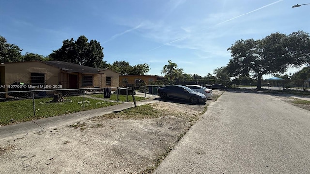 1230 NW 113th Ter, Miami, FL 33167 - view of asphalt road with street lighting and sidewalks