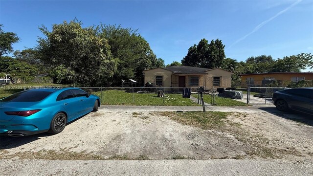 1230 NW 113th Ter, Miami, FL 33167 - view of front facade featuring a gate