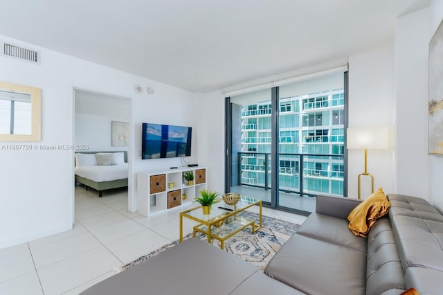 31 SE 6th St Unit 2408, Miami, FL 33131 - living room featuring floor to ceiling windows, plenty of natural light, tile patterned flooring, and baseboards