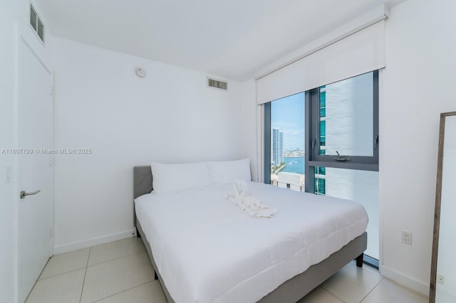 31 SE 6th St Unit 2408, Miami, FL 33131 - bedroom featuring baseboards and tile patterned floors