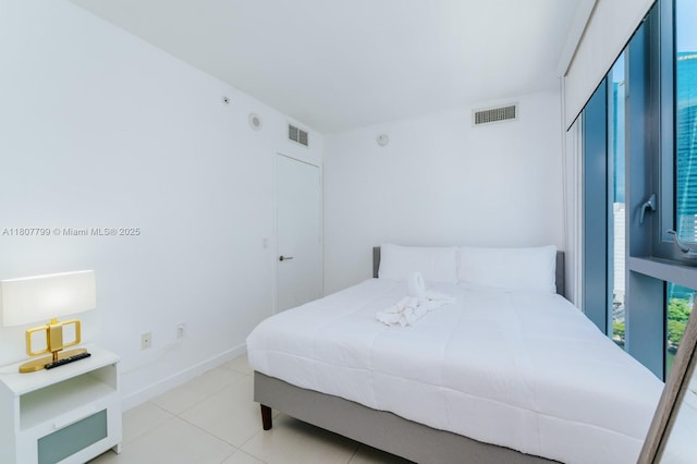 31 SE 6th St Unit 2408, Miami, FL 33131 - bedroom with tile patterned floors and a closet
