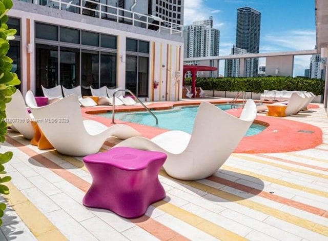 31 SE 6th St Unit 2408, Miami, FL 33131 - community pool with a city view and a patio area