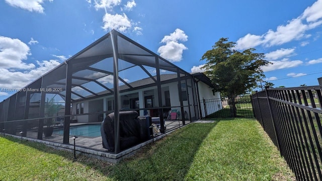 311 SE 14th St, Cape Coral, FL 33990 - rear view of house featuring a patio area, glass enclosure, and stucco siding