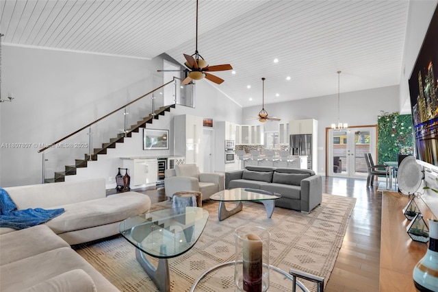 1550 Tyler St, Hollywood, FL 33020 - living room with high vaulted ceiling, a ceiling fan, stairs, light wood-style floors, and recessed lighting