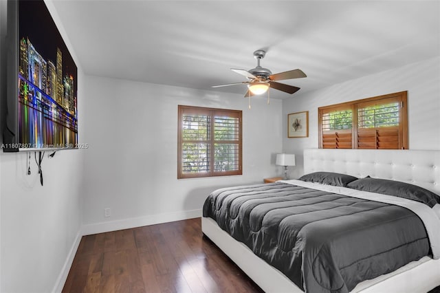 1550 Tyler St, Hollywood, FL 33020 - bedroom featuring multiple windows, baseboards, hardwood / wood-style floors, and a ceiling fan