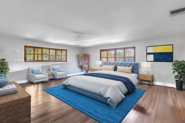 1550 Tyler St, Hollywood, FL 33020 - bedroom with multiple windows, baseboards, and wood finished floors