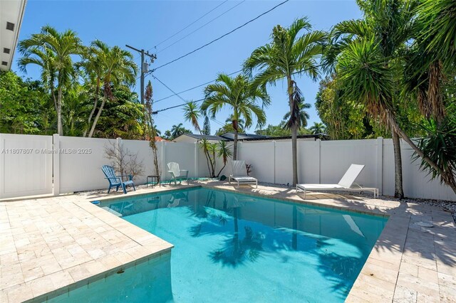 1550 Tyler St, Hollywood, FL 33020 - view of swimming pool featuring a fenced backyard and a patio