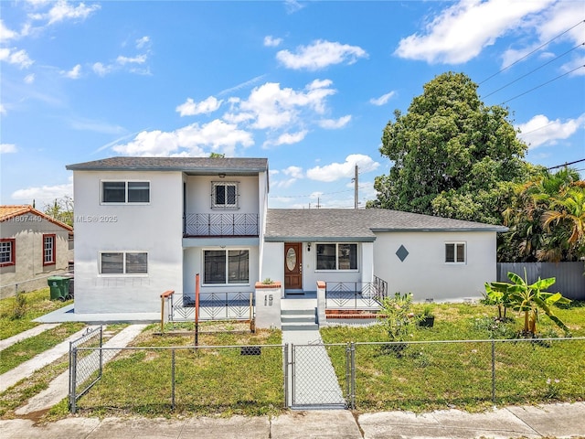 15 W 55th St, Hialeah, FL 33012 - view of front of home with covered porch, a gate, stucco siding, and a fenced front yard