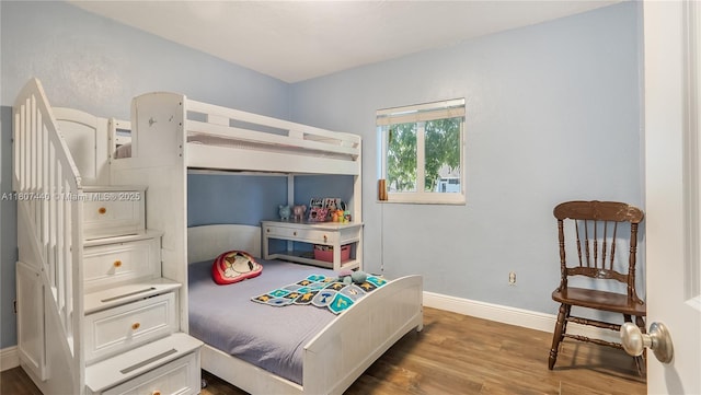 15 W 55th St, Hialeah, FL 33012 - bedroom featuring wood finished floors and baseboards
