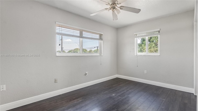 15 W 55th St, Hialeah, FL 33012 - spare room featuring baseboards, dark wood-style flooring, and ceiling fan