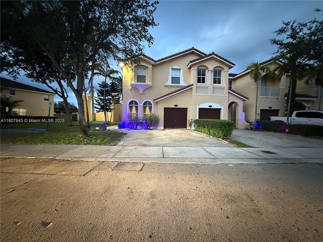 15029 SW 8th Ter, Miami, FL 33194 - mediterranean / spanish-style home featuring an attached garage, stucco siding, driveway, and a tile roof