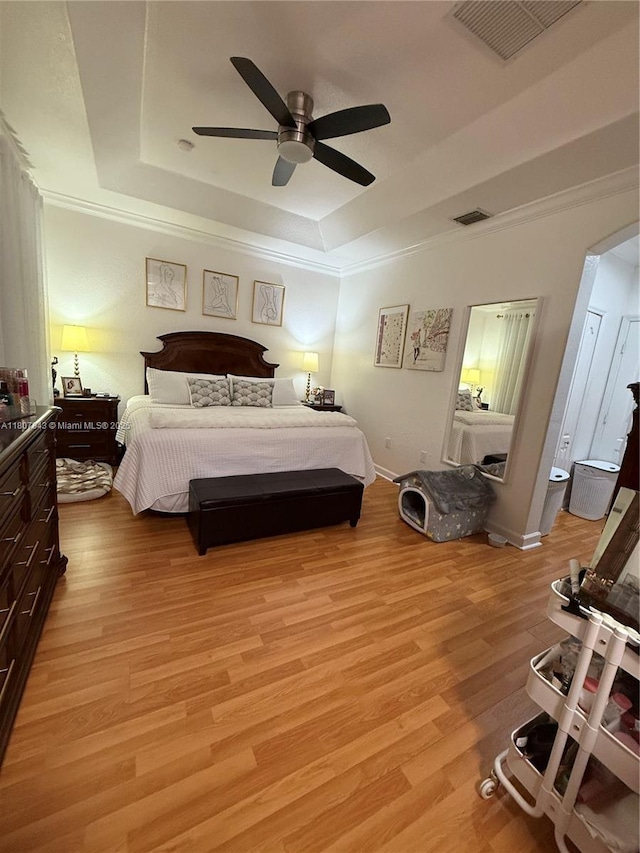 15029 SW 8th Ter, Miami, FL 33194 - bedroom with a tray ceiling, light wood-style floors, crown molding, a ceiling fan, and baseboards