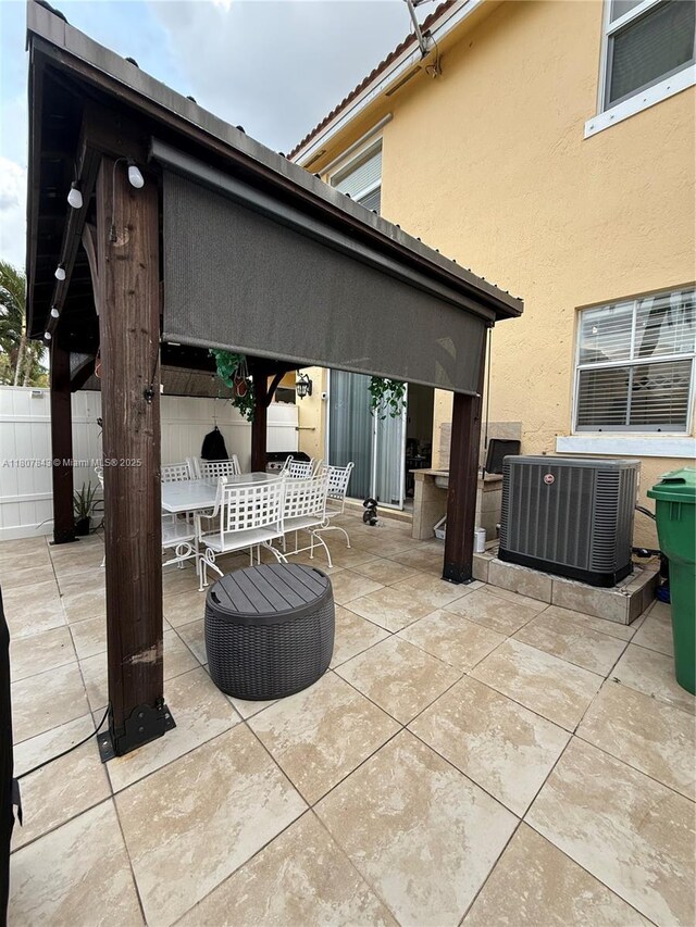 15029 SW 8th Ter, Miami, FL 33194 - view of patio / terrace featuring cooling unit and outdoor dining area