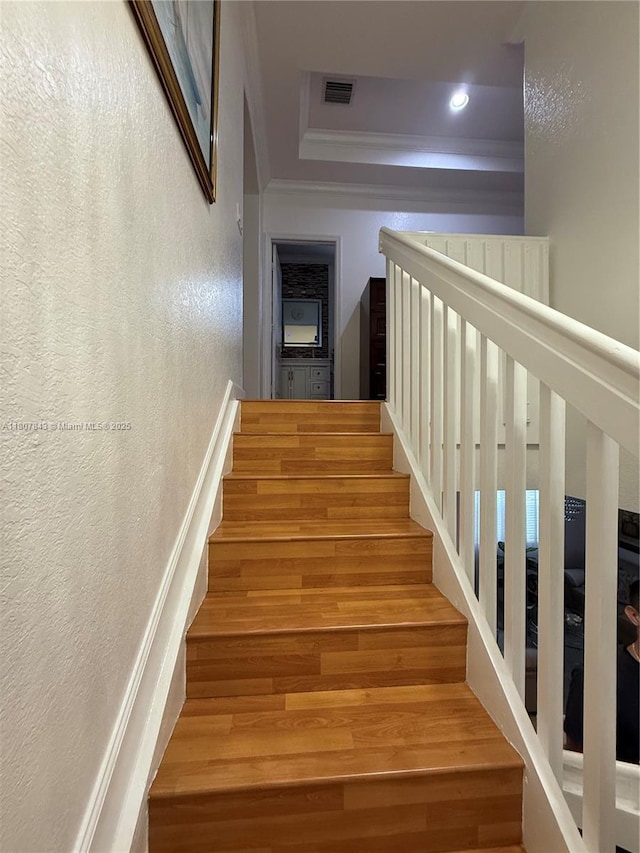 15029 SW 8th Ter, Miami, FL 33194 - stairs featuring crown molding, wood finished floors, a textured wall, and recessed lighting
