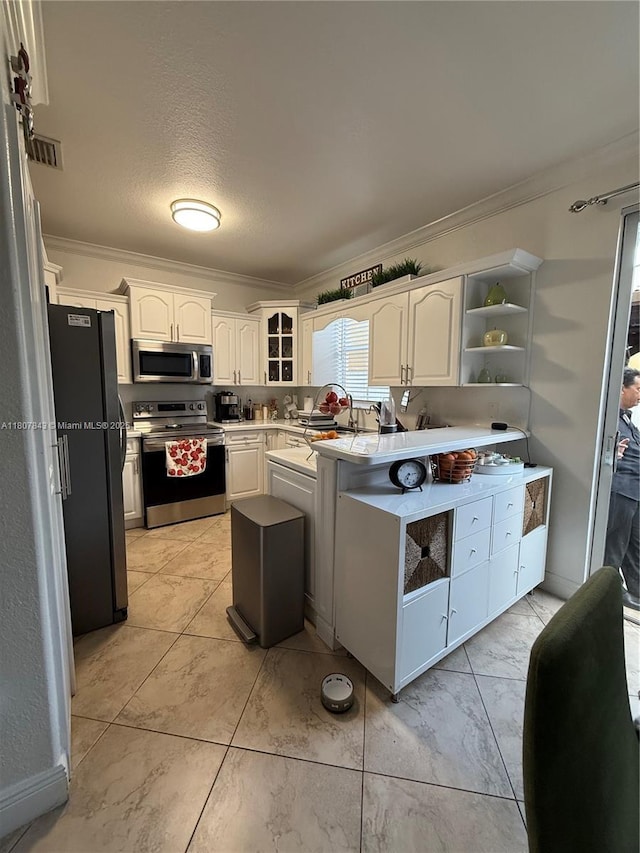 15029 SW 8th Ter, Miami, FL 33194 - kitchen with stainless steel appliances, ornamental molding, open shelves, white cabinets, and light countertops