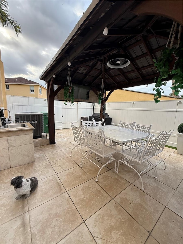 15029 SW 8th Ter, Miami, FL 33194 - view of patio featuring outdoor dining area, a gazebo, and central air condition unit