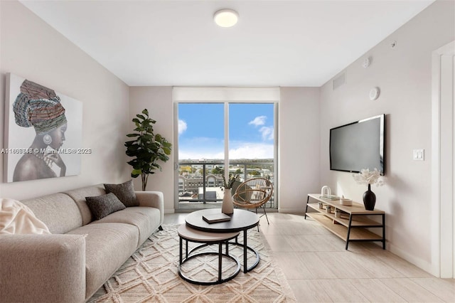 3900 Biscayne Blvd Unit N-905, Miami, FL 33137 - living room featuring floor to ceiling windows, baseboards, and light tile patterned floors