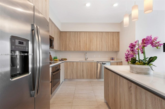 3900 Biscayne Blvd Unit N-905, Miami, FL 33137 - kitchen featuring stainless steel appliances, light brown cabinets, modern cabinets, a sink, and recessed lighting