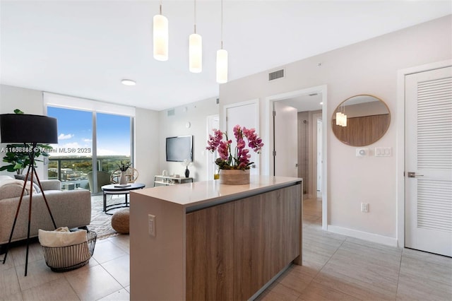 3900 Biscayne Blvd Unit N-905, Miami, FL 33137 - kitchen featuring a center island, open floor plan, modern cabinets, light countertops, and light tile patterned floors
