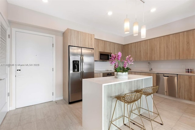 3900 Biscayne Blvd Unit N-905, Miami, FL 33137 - kitchen with stainless steel appliances, modern cabinets, a sink, light countertops, and a kitchen breakfast bar