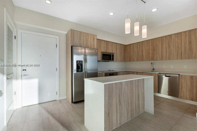 3900 Biscayne Blvd Unit N-905, Miami, FL 33137 - kitchen with appliances with stainless steel finishes, modern cabinets, a center island, a sink, and light countertops