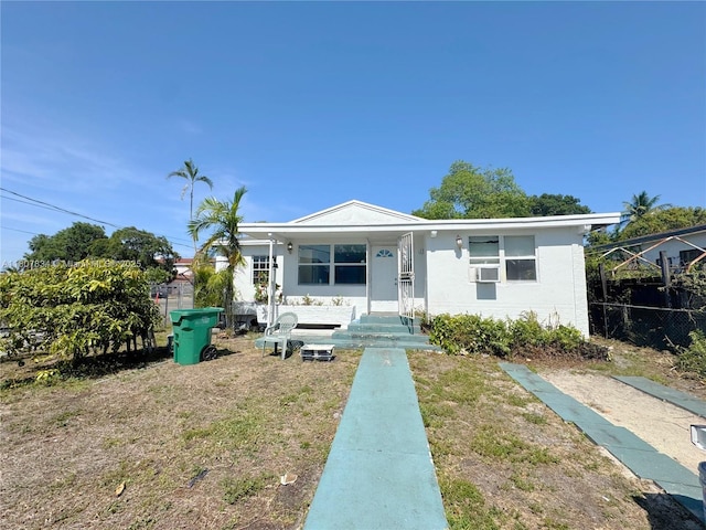 18201 NW 20th Ave, Miami Gardens, FL 33056 - view of front of house featuring cooling unit and a porch