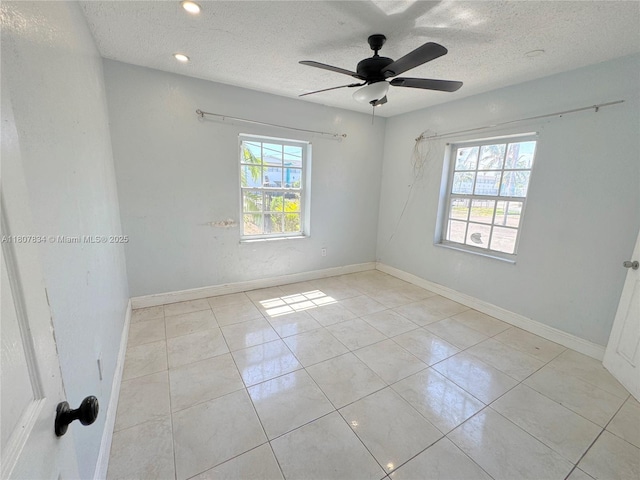 18201 NW 20th Ave, Miami Gardens, FL 33056 - empty room with a textured ceiling, ceiling fan, tile patterned floors, baseboards, and recessed lighting