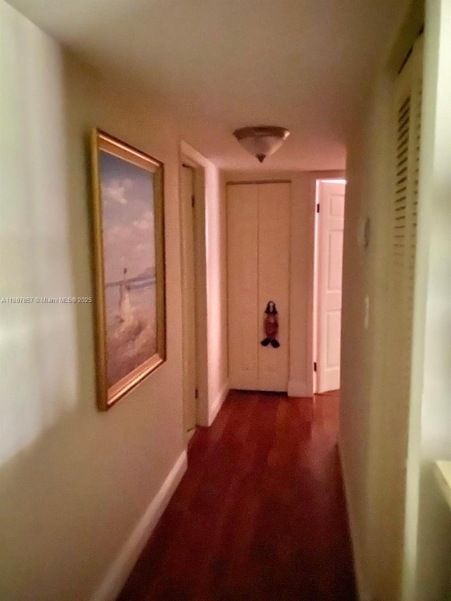 7707 Ashmont Cir Unit 214, Tamarac, FL 33321 - hallway with baseboards and dark wood finished floors