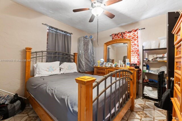 2655 NW 14th Ave, Miami, FL 33142 - bedroom with light tile patterned flooring and ceiling fan