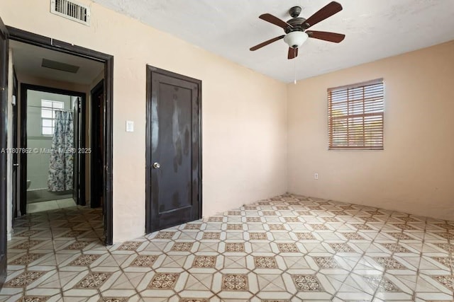2655 NW 14th Ave, Miami, FL 33142 - unfurnished room featuring healthy amount of natural light and a ceiling fan