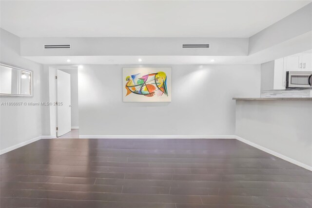 12125 NE 5th Ave, North Miami, FL 33161 - unfurnished living room featuring wood finished floors, recessed lighting, and baseboards