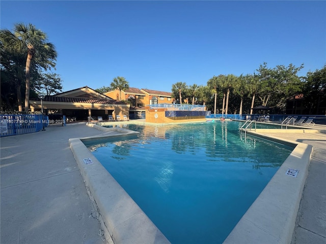 15569 N Miami Lakeway N Unit 204, Miami Lakes, FL 33014 - community pool featuring a patio area