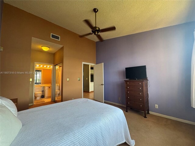 15569 N Miami Lakeway N Unit 204, Miami Lakes, FL 33014 - bedroom featuring a textured ceiling, carpet, connected bathroom, baseboards, and a ceiling fan