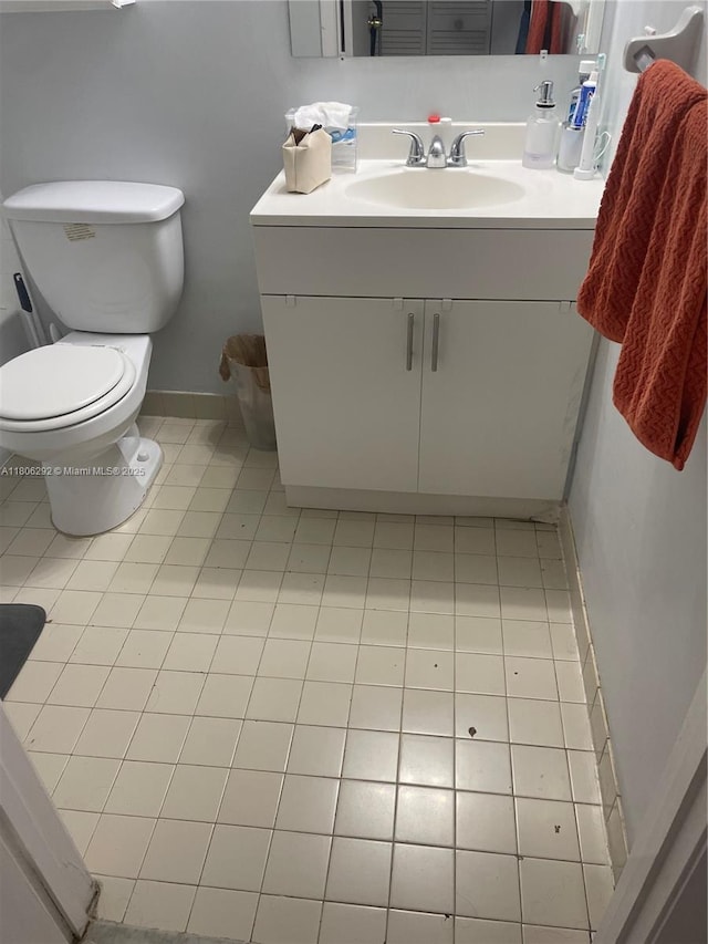 5200 NW 31st Ave Unit 102, Fort Lauderdale, FL 33309 - bathroom featuring vanity, baseboards, toilet, and tile patterned flooring