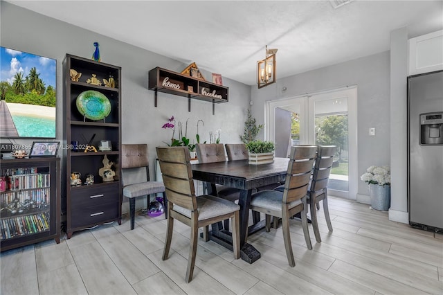 2161 SW 87th Ct, Miami, FL 33165 - dining room with wood finish floors, a chandelier, and french doors