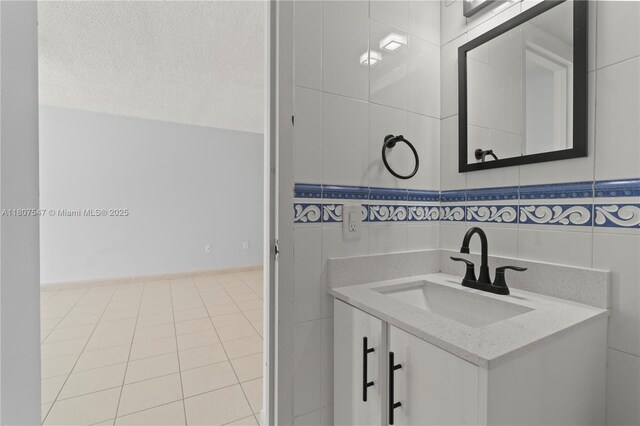 6969 Collins Ave Unit 707, Miami Beach, FL 33141 - bathroom featuring vanity, tile walls, and tile patterned floors