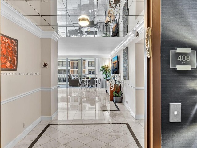 10155 Collins Ave Unit 408, Bal Harbour, FL 33154 - hallway with inlaid floor details, a high ceiling, and crown molding