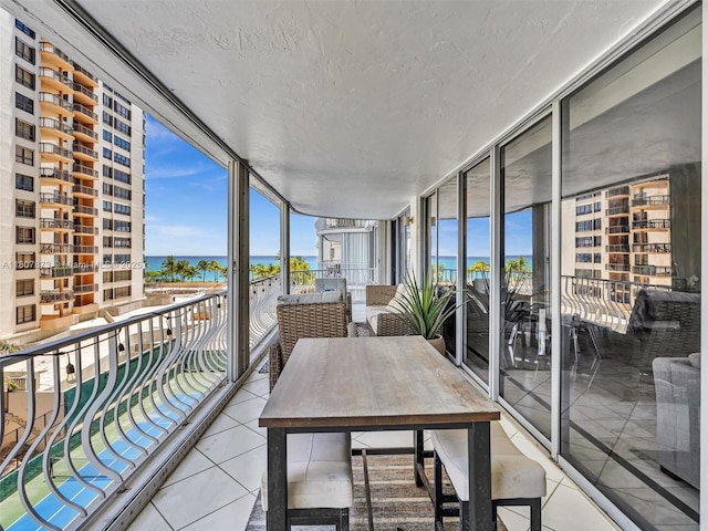 10155 Collins Ave Unit 408, Bal Harbour, FL 33154 - sunroom / solarium with a water view