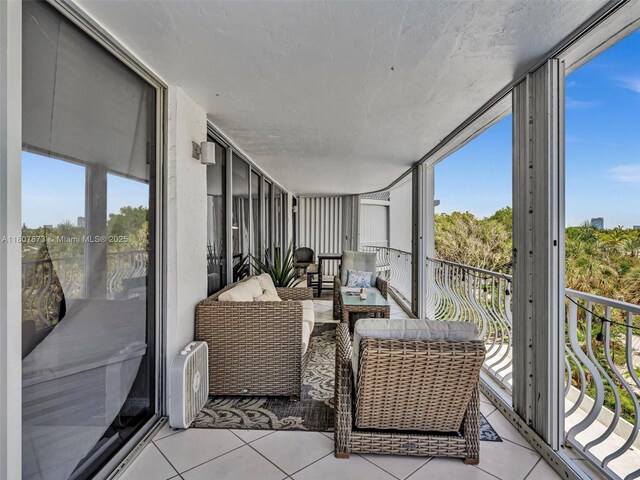 10155 Collins Ave Unit 408, Bal Harbour, FL 33154 - sunroom with plenty of natural light and outdoor lounge area