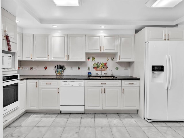 10155 Collins Ave Unit 408, Bal Harbour, FL 33154 - kitchen featuring white appliances, white cabinetry, recessed lighting, and backsplash