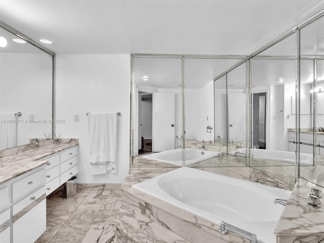 10155 Collins Ave Unit 408, Bal Harbour, FL 33154 - bathroom with a garden tub and vanity